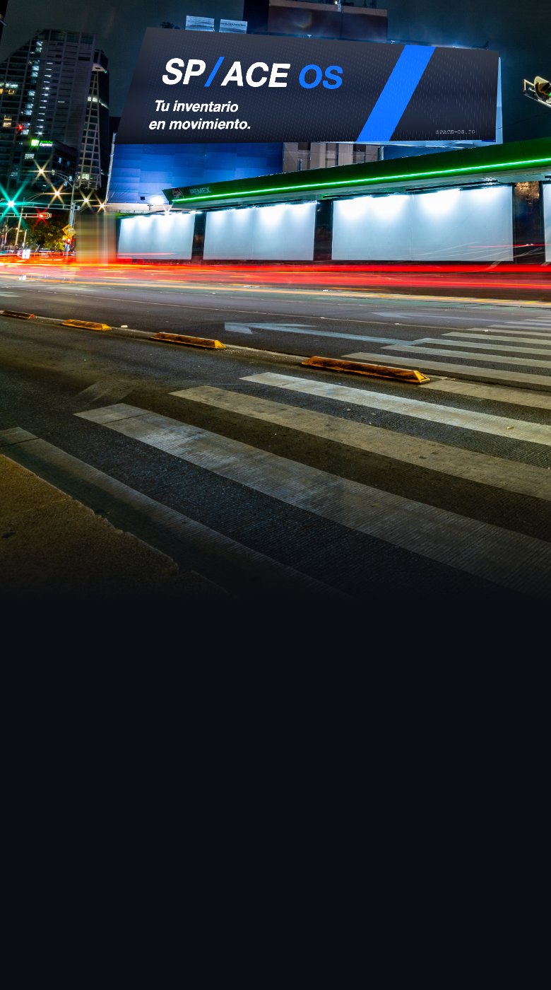 Digital billboard showing SP/ACE OS on a city avenue at night